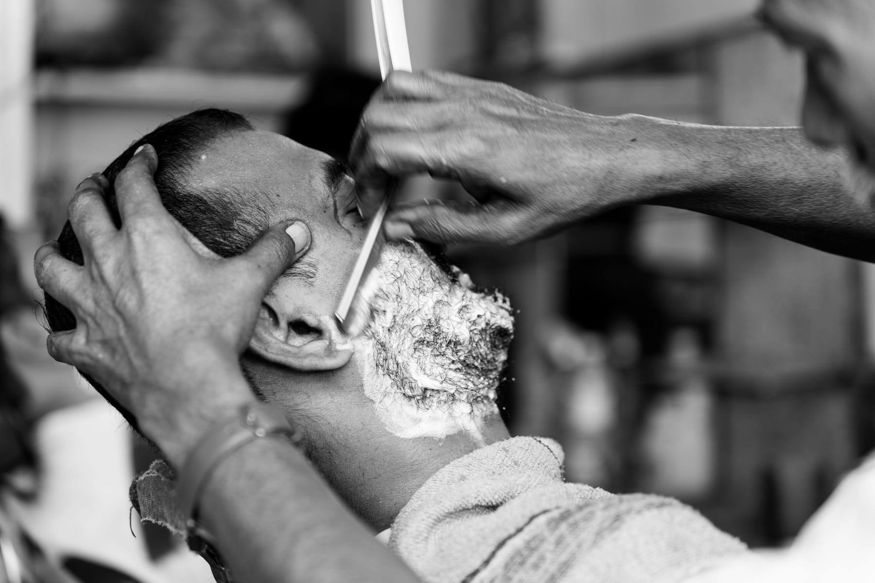 Straight-razor shave in black and white